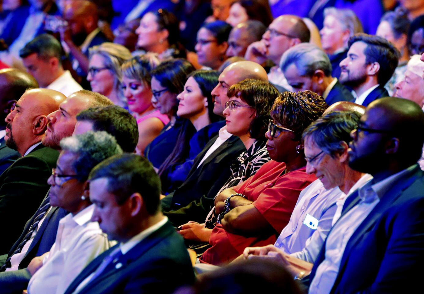 Members of the audience listen to a Democratic primary debate hosted by NBC News at the Adrienne Arsht Center for the Performing Art, Wednesday, June 26, 2019, in Miami.