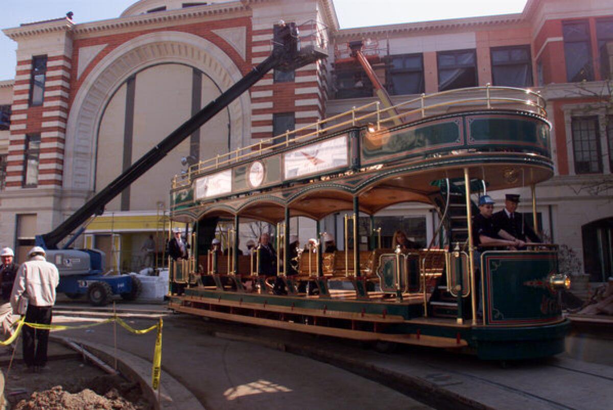 Conductor Greg Schmidt drives a wireless trolley on the inaugural ride at The Grove.