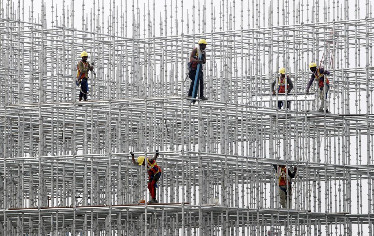 FILE - Construction workers prepare a scaffolding at a construction site at Hajji Ali in Mumbai, India, on Jan. 8, 2022. India’s central bank on Wednesday, Aug. 3, raised its key interest rate by 50 basis points to 5.4% in its third such hike since May as it focuses on containing inflation. (AP Photo/Rajanish kakade, File)