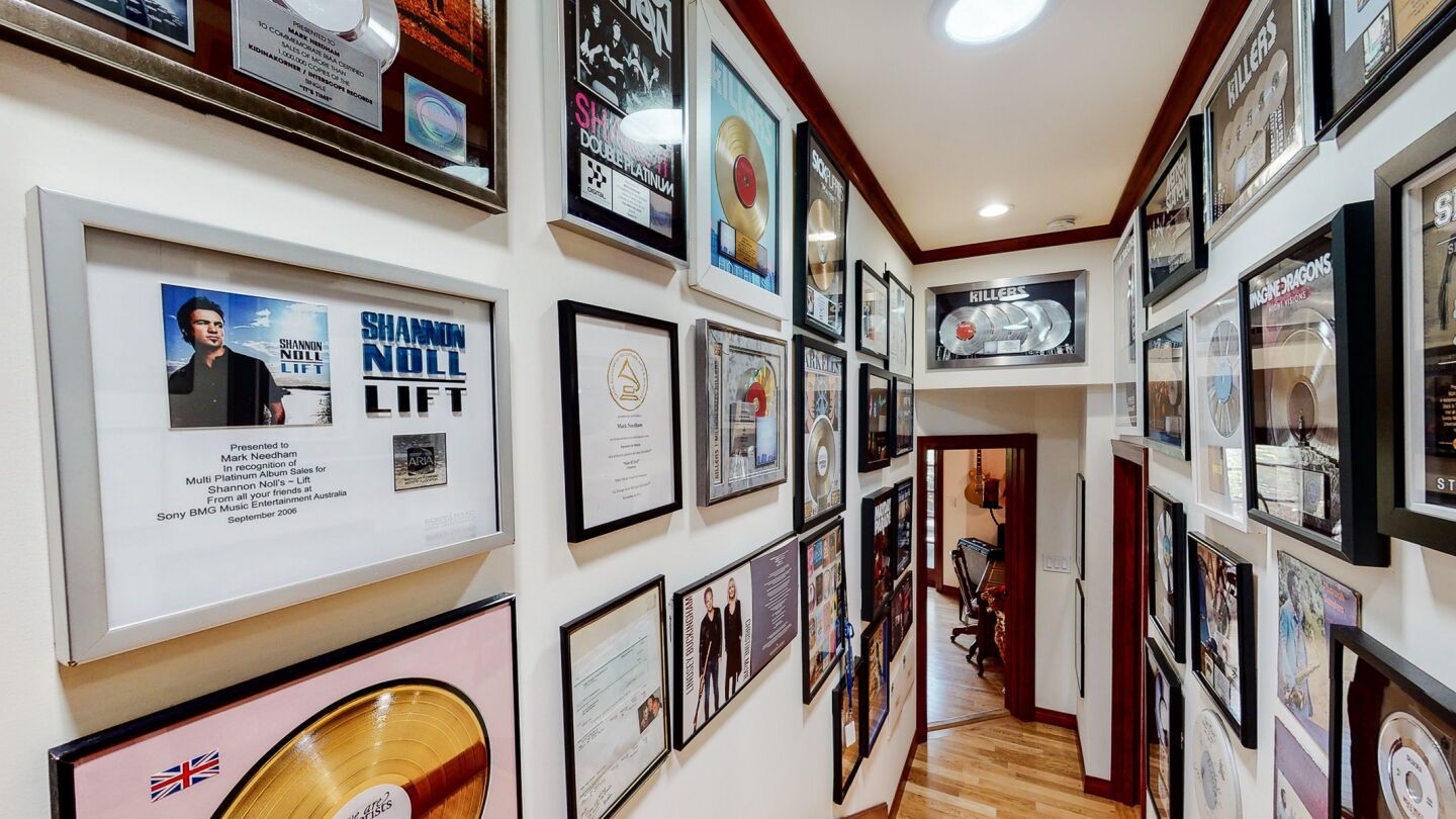 Gold records line the walls leading to the recording studio.