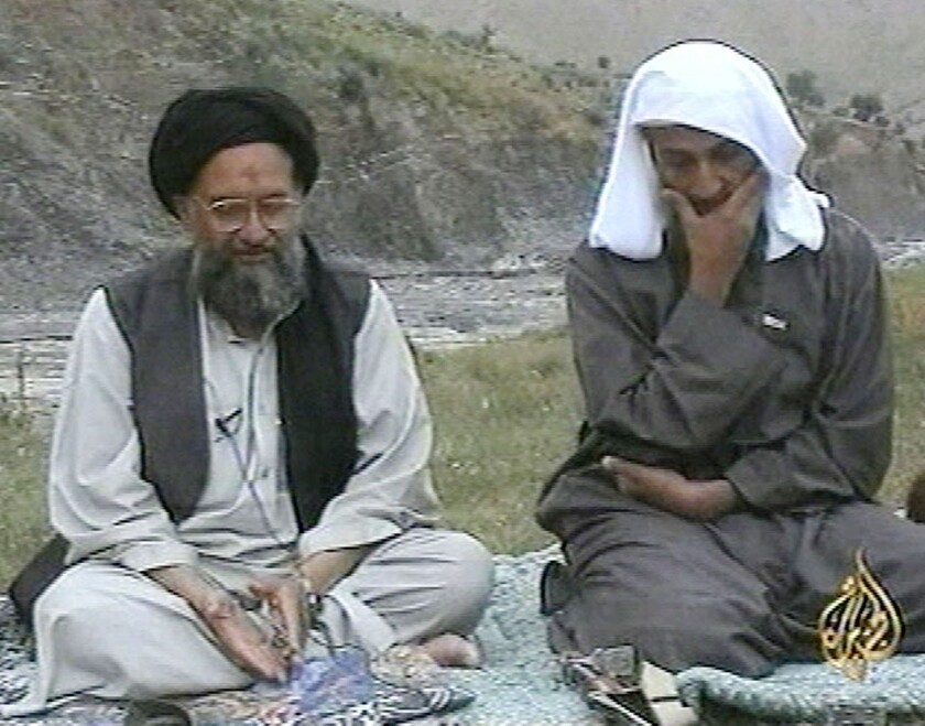 FILE - In this television image from Arab satellite station Al-Jazeera, Osama bin Laden, right, listens as his top deputy Ayman al-Zawahri speaks at an undisclosed location, in this image made from undated video tape broadcast by the station April 15, 2002. A U.S. airstrike has killed al-Qaida leader Ayman al-Zawahri in Afghanistan, according to a person familiar with the matter. President Joe Biden will speak about the operation on Monday night, Aug. 1, 2022, from the White House. (AP Photo/Al-Jazeera/APTN, file)