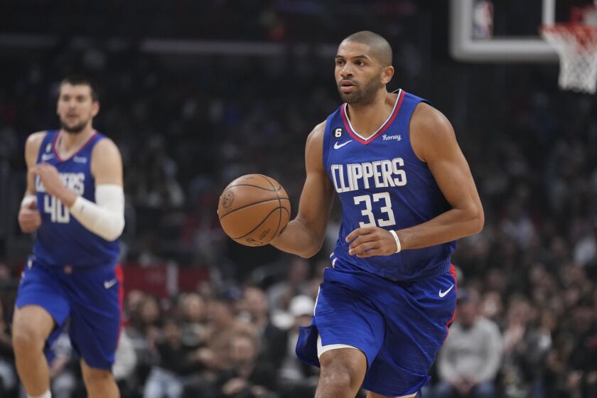 Los Angeles Clippers forward Nicolas Batum (33) dribbles against the Chicago Bulls during the first half of an NBA basketball game Monday, March 27, 2023, in Los Angeles. (AP Photo/Marcio Jose Sanchez)
