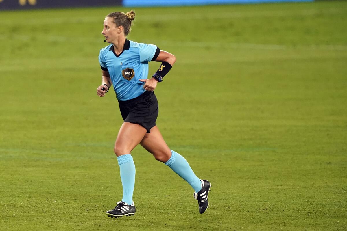 Referee Tori Penso runs down the pitch during the second half of a match between D.C. United and Nashville SC.
