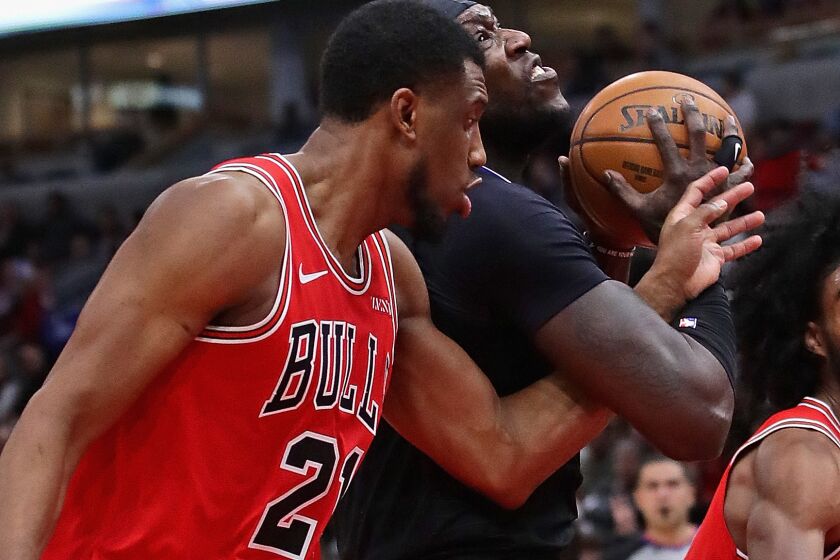 CHICAGO, ILLINOIS - DECEMBER 14: Montrezl Harrell #5 of the LA Clippers is fouled by Thaddeus Young #21 of the Chicago Bulls at the United Center on December 14, 2019 in Chicago, Illinois. NOTE TO USER: User expressly acknowledges and agrees that , by downloading and or using this photograph, User is consenting to the terms and conditions of the Getty Images License Agreement. (Photo by Jonathan Daniel/Getty Images)