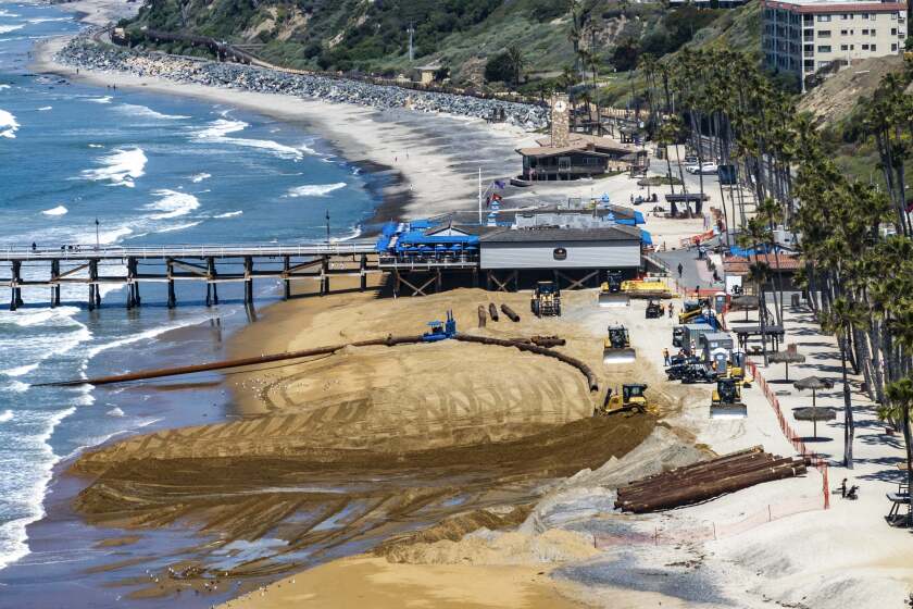 New sand sits south of the pier and the old, rocky sand is on the north side during the first part of a sand replenishment project in San Clemente, CA, on Tuesday, April 30, 2024. (Photo by Jeff Gritchen, Orange County Register/SCNG)