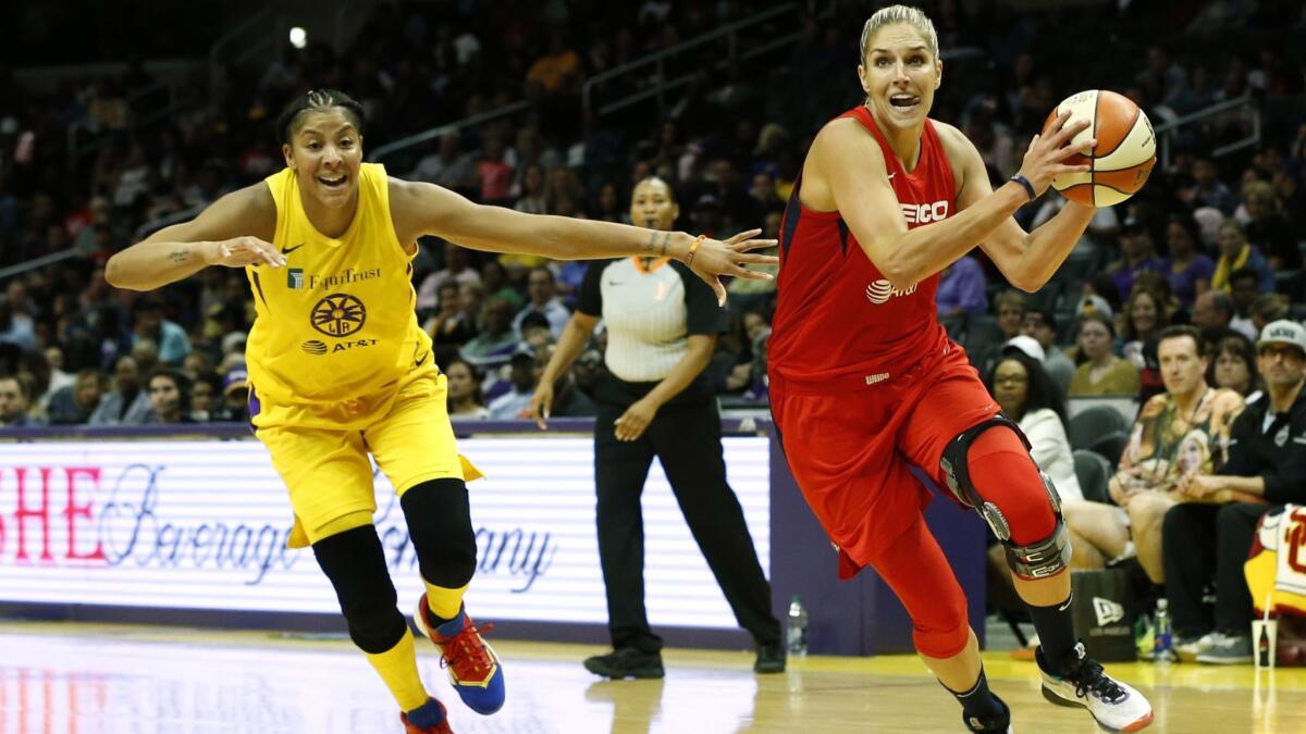Washington Mystics Forward Elena Delle Donne, right, drives toward the hoop with Sparks forward Candace Parker close behind during a game at Staples Center on Tuesday.