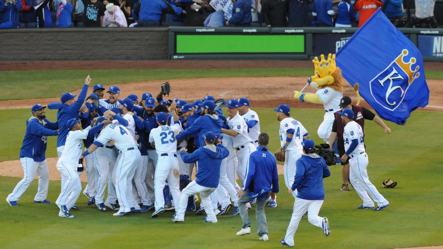 The Royal's celebrate winning the American League pennant after game four of the ALCS between Orioles and Royals at Kauffman Stadium in Kansas City.