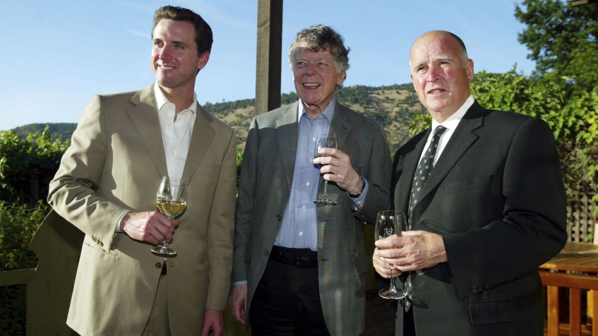 In this 2004 photo, then-San Francisco Mayor Gavin Newsom, left, Gordon Getty and then-Oakland Mayor Jerry Brown enjoy a pre-dinner glass of wine during an event at Newsom's PlumpJack Winery in Oakville.