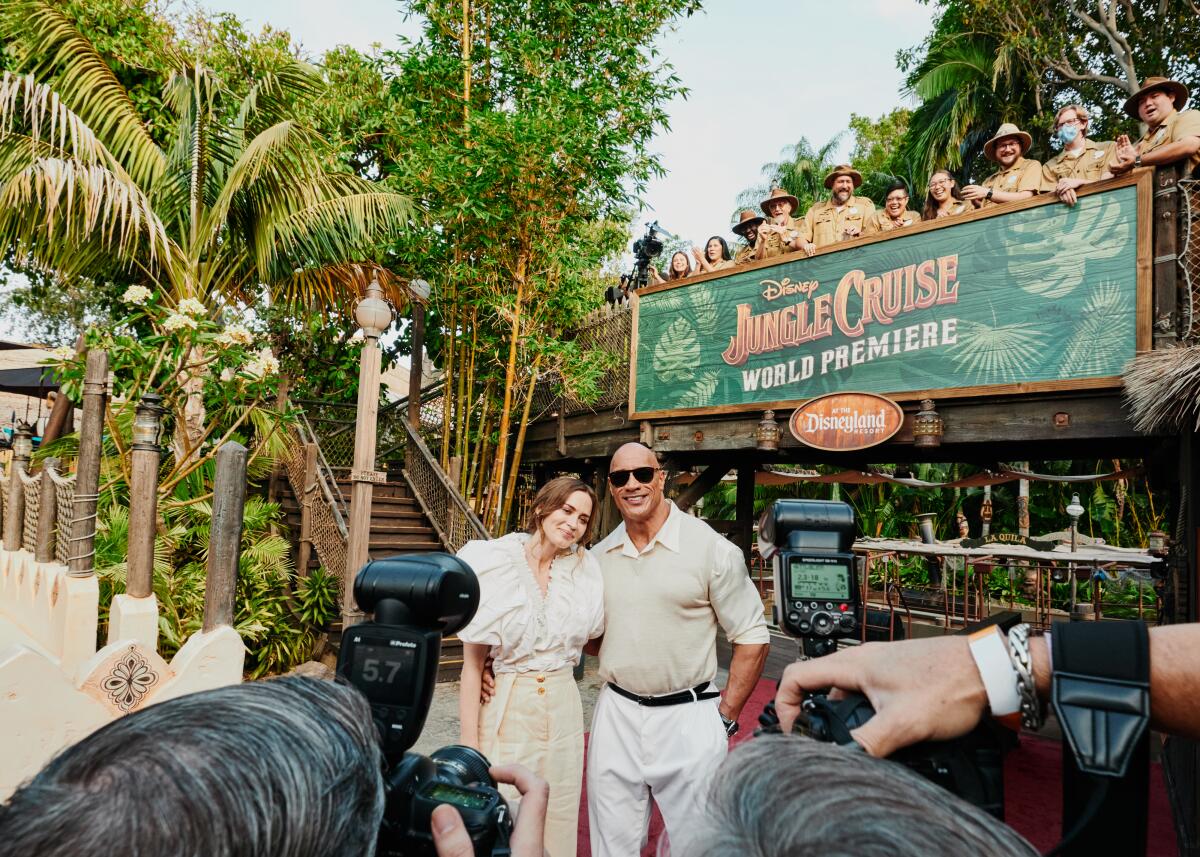 Emily Blunt and Dwayne Johnson exit the Jungle Cruise ride in Disneyland on July 24.