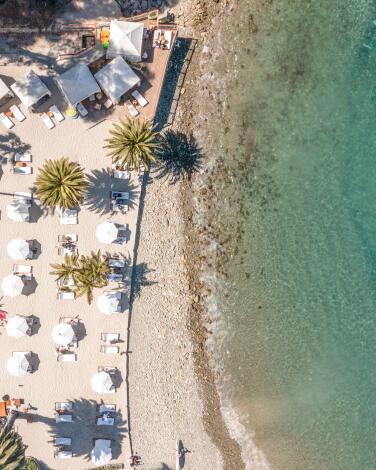 Catalina Island, CA - June 25: An aerial view of people playing in the water and enjoying Descanso Beach Club, which features Avalon's only beach side restaurant and bar Friday, June 25, 2021 in Catalina Island, CA. (Allen J. Schaben / Los Angeles Times)