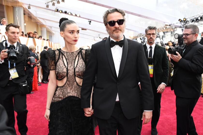 US actor Joaquin Phoenix (R) and US actress Rooney Mara arrive for the 92nd Oscars at the Dolby Theatre in Hollywood, California on February 9, 2020. (Photo by VALERIE MACON / AFP) (Photo by VALERIE MACON/AFP via Getty Images)