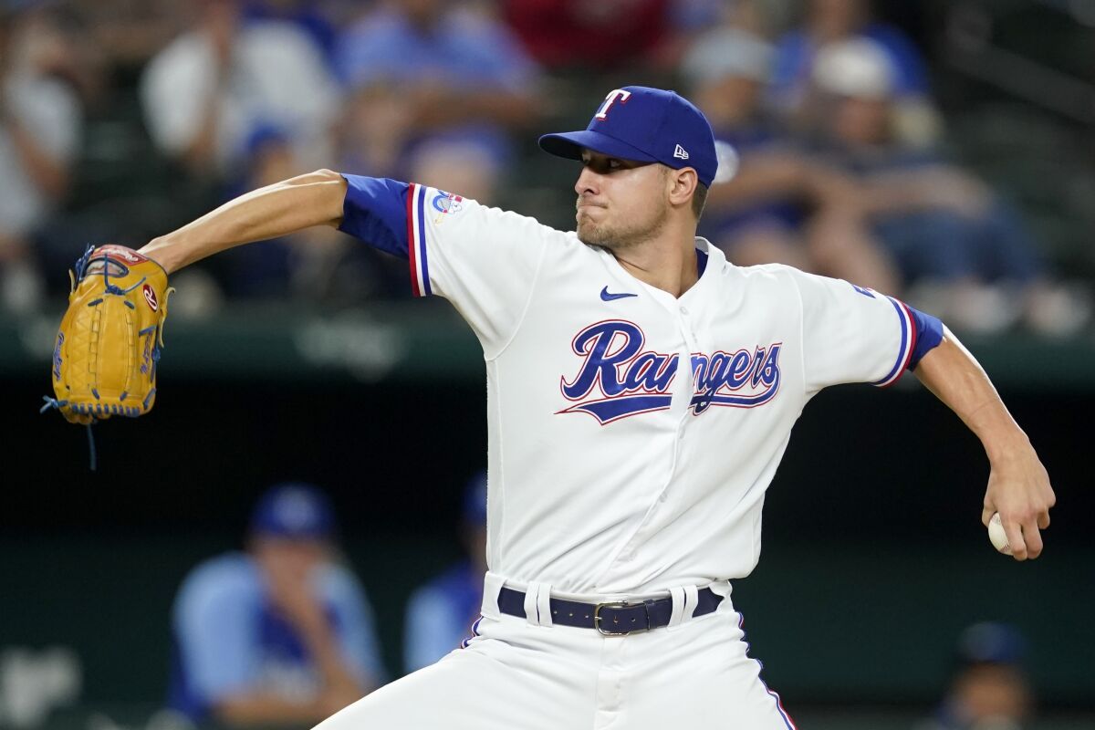 Texas Rangers relief pitcher Brett Martin throws to the Kansas City Royals in the fifth inning of a baseball game, Wednesday, May 11, 2022, in Arlington, Texas. (AP Photo/Tony Gutierrez)