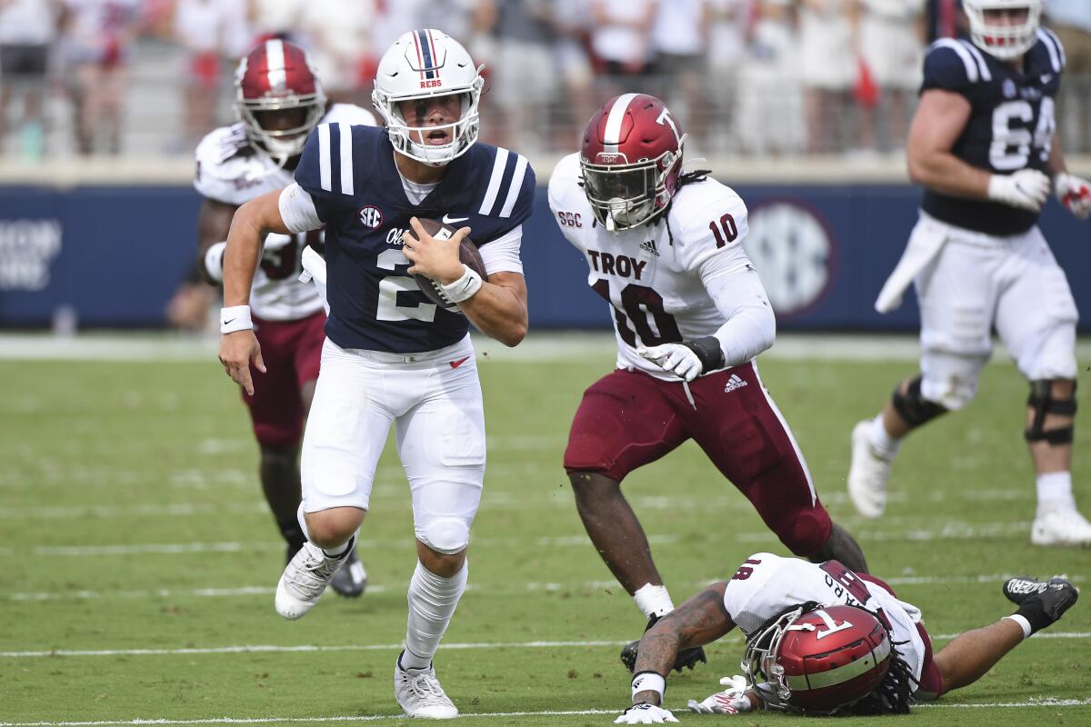 Mississippi quarterback Jaxson Dart runs the ball against Troy on Sept. 3, 2022.