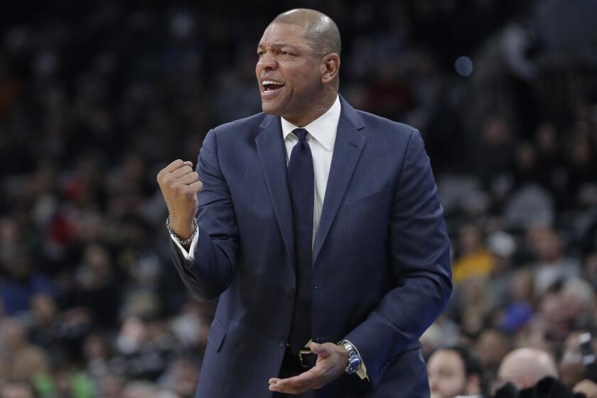 Los Angeles Clippers head coach Doc Rivers talks to his players during the first half of an NBA basketball game against the San Antonio Spurs, Thursday, Dec. 13, 2018, in San Antonio. (AP Photo/Eric Gay)