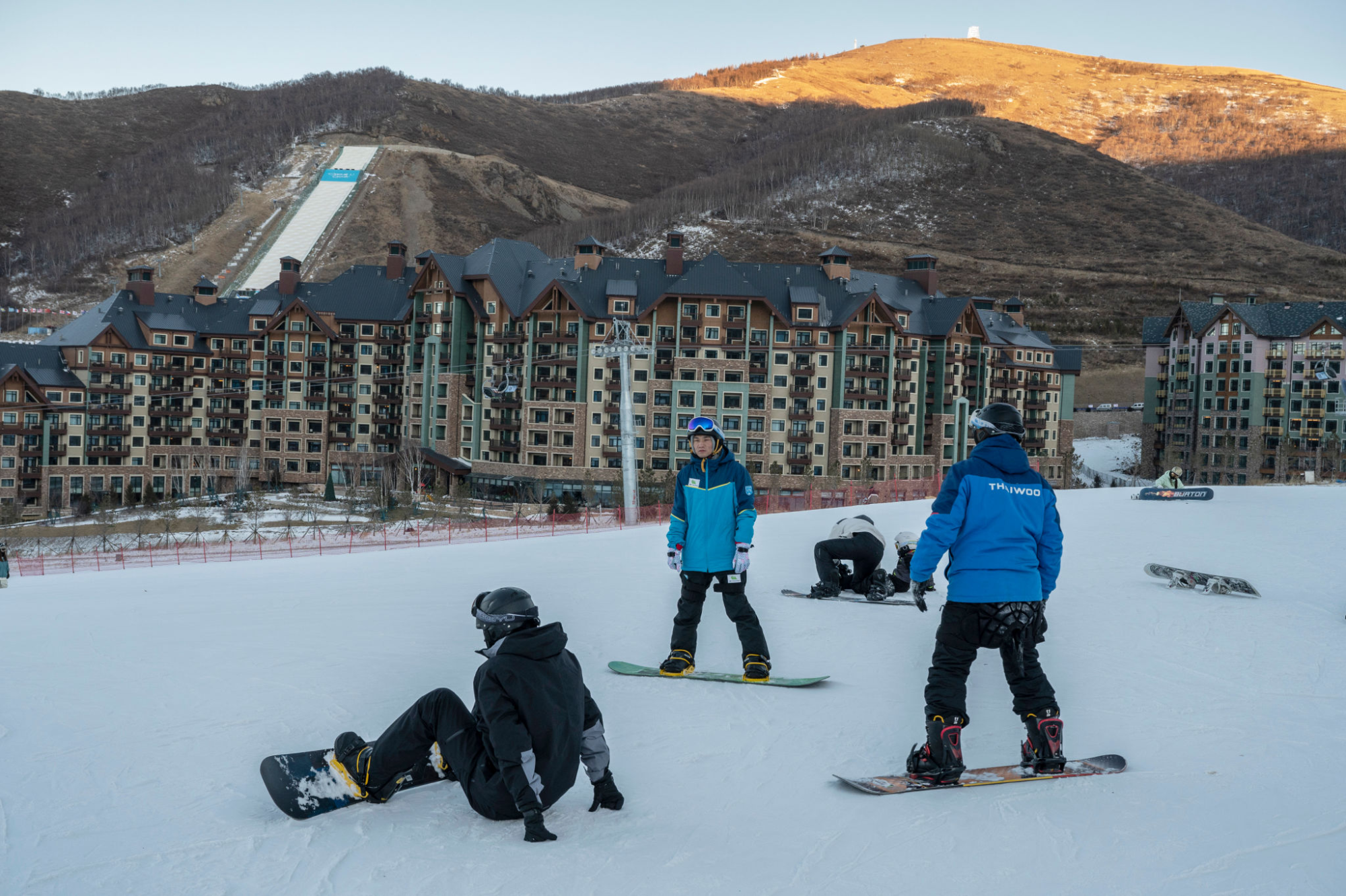 Snowboarders practice in the beginner's area at Thaiwoo Ski Resort in Zhangjiakou, China in December.