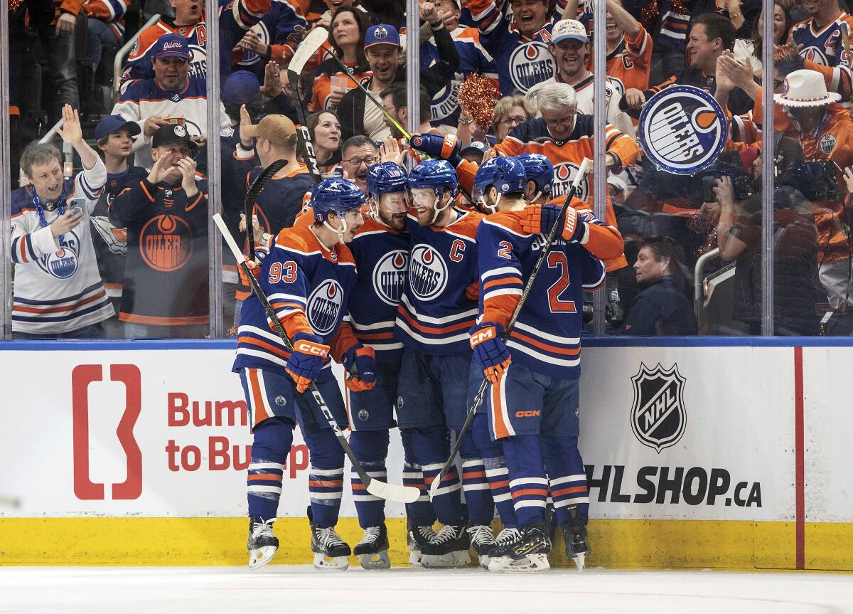 Edmonton Oilers' Ryan Nugent-Hopkins (93), Zach Hyman (18), Connor McDavid.