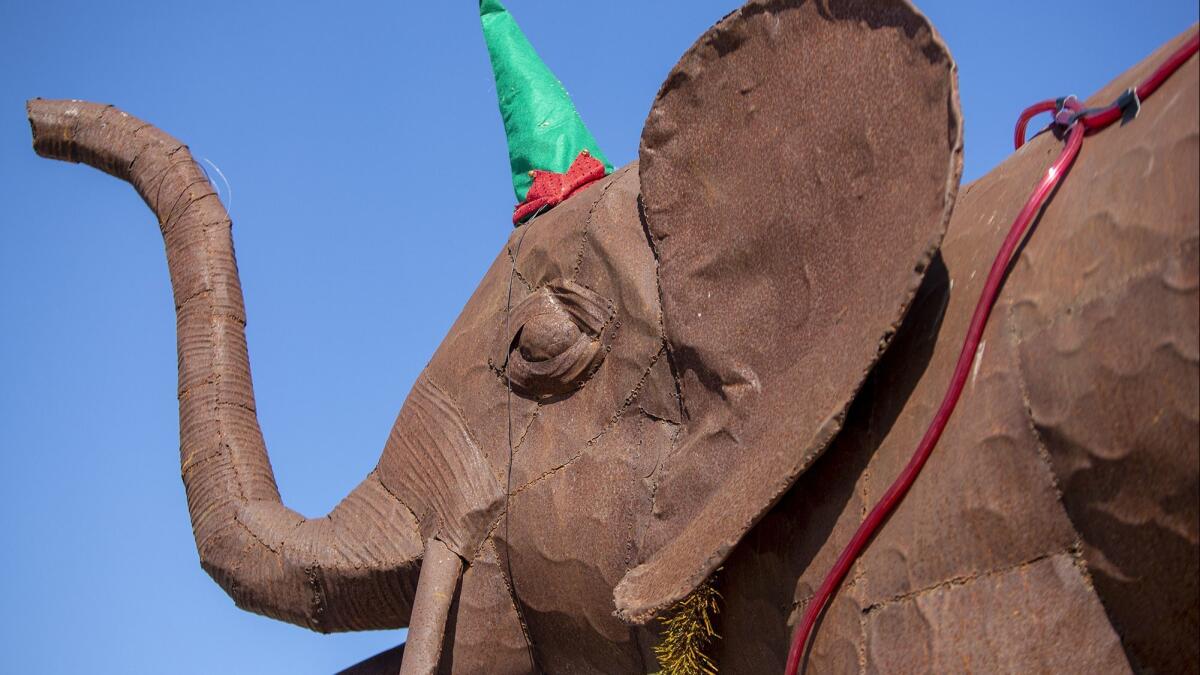 A pair of giraffes and an elephant are part of the decorations for Greg Killingsworth’s boat Paradise Found, that will participate in the Newport Beach Boat Parade.