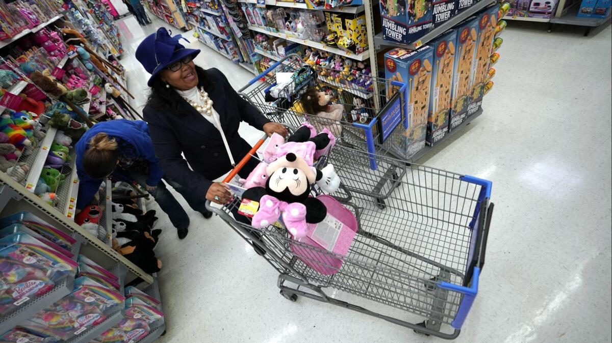 Shoppers make their way through the toy isles at a Walmart Supercenter in Houston on Nov. 9.