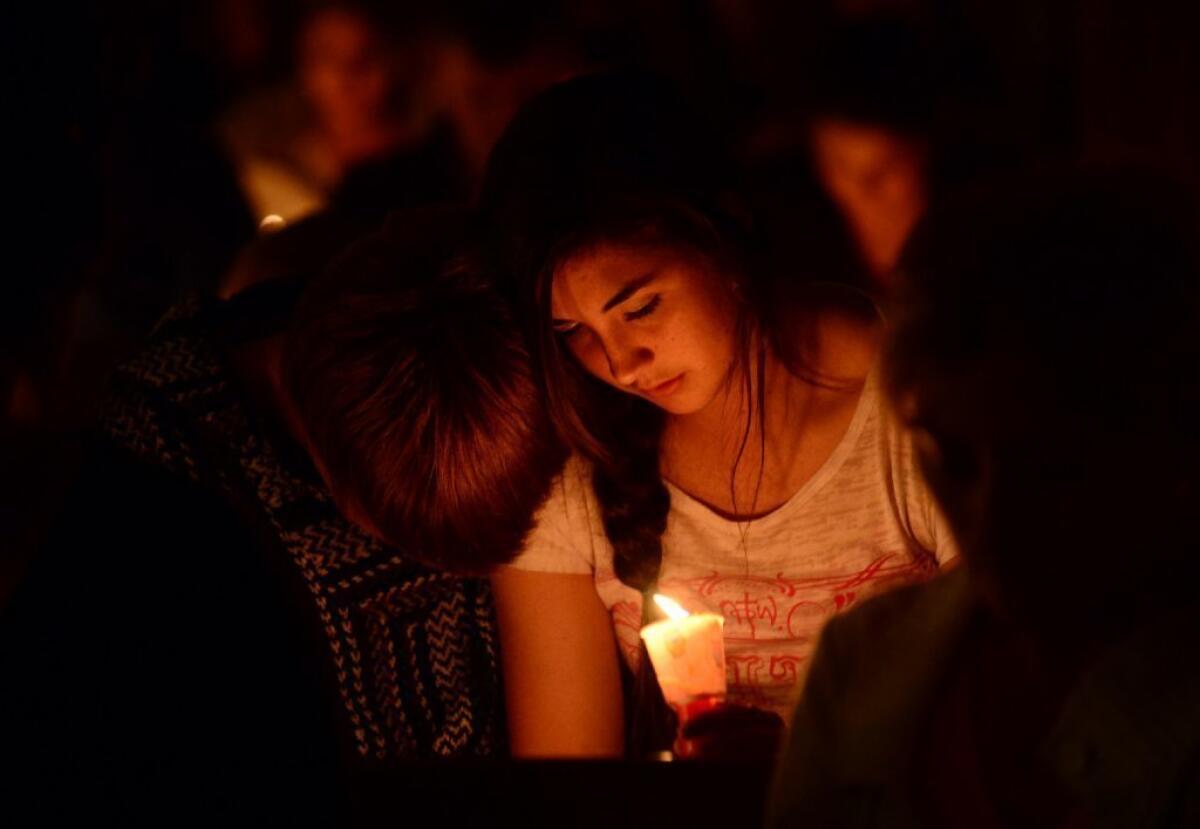 People gather for a candlelight vigil at St. Mary's Catholic Church in West, Texas, in memory of those killed by the fertilizer plant explosion.