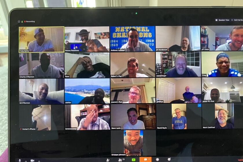 Members of UCLA's 1995 men's basketball team share some laughs over Zoom while conducting a virtual reunion on April 3, 2020 in celebration of the 25th anniversary of their NCAA title.
