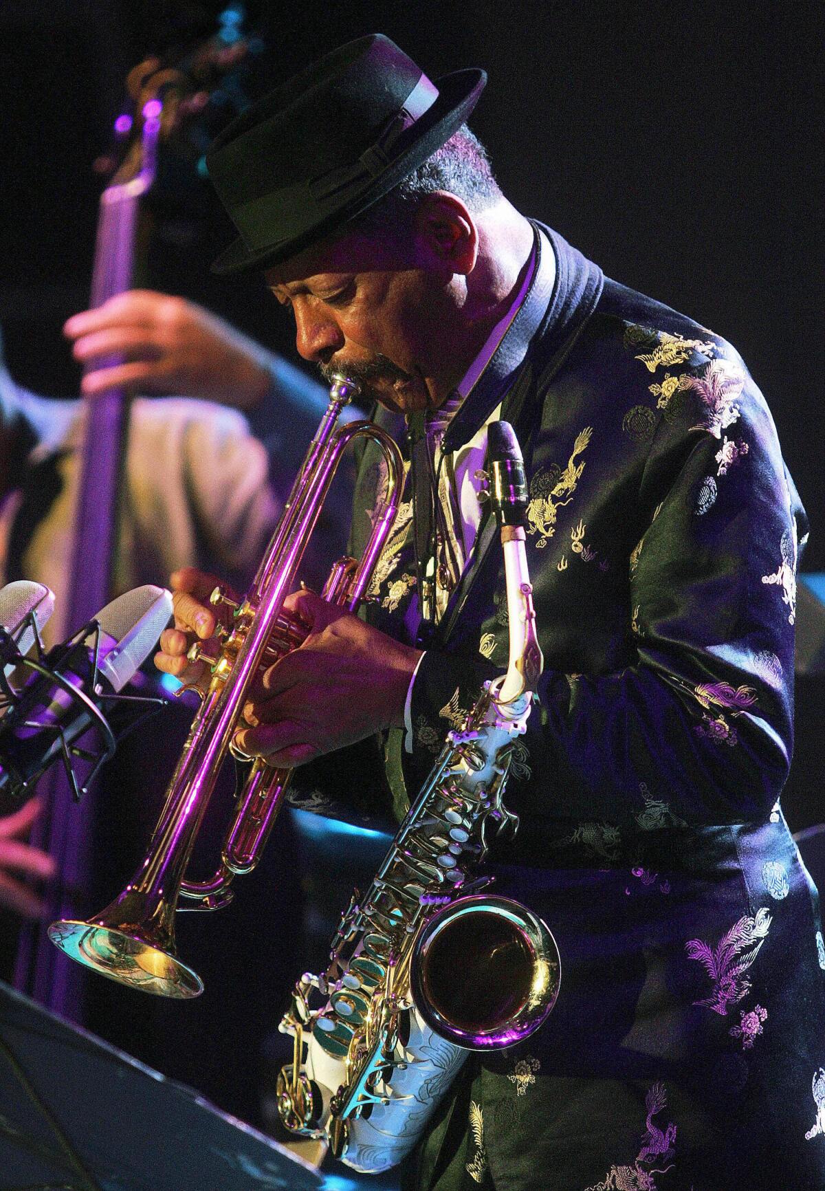 Saxophonist Ornette Coleman performs on trumpet