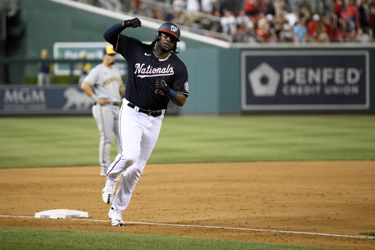 Washington Nationals' Josh Bell celebrates his three-run home run during the sixth inning of the team's baseball game against the Milwaukee Brewers, Friday, June 10, 2022, in Washington. (AP Photo/Nick Wass)
