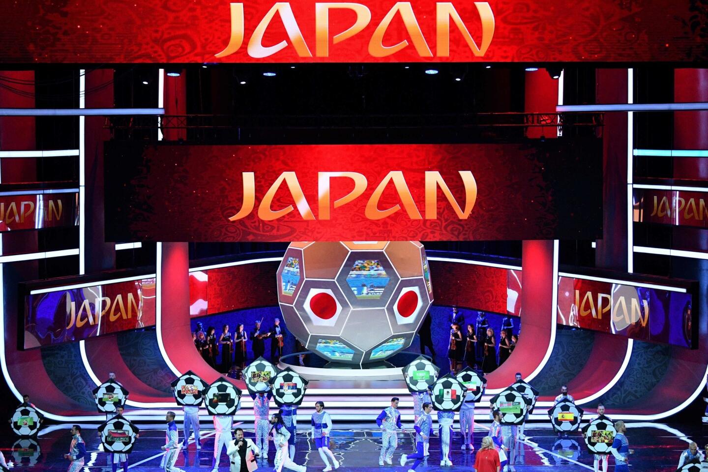 Artists perform on stage as "Japan" is displayed on screens during the Final Draw for the 2018 FIFA World Cup football tournament at the State Kremlin Palace in Moscow on December 1, 2017. The 2018 FIFA World Cup will be held from June 14 and July 15, 2018, in 11 Russian cities. / AFP PHOTO / Mladen ANTONOVMLADEN ANTONOV/AFP/Getty Images ** OUTS - ELSENT, FPG, CM - OUTS * NM, PH, VA if sourced by CT, LA or MoD **