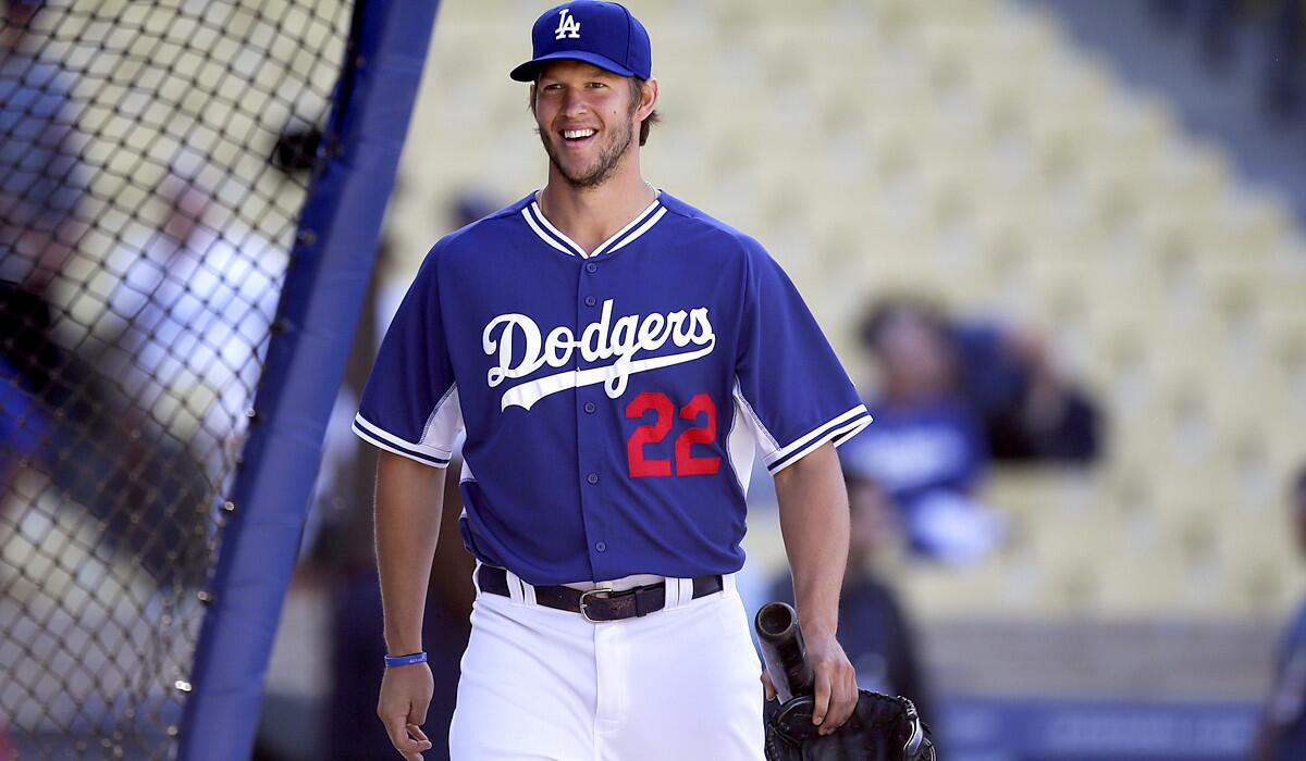 Dodgers starting pitcher Clayton Kershaw is all smiles before a game against the Philadelphia Phillies on Thursday, a day before he made a rehab start at a California League game in Rancho Cucamonga.