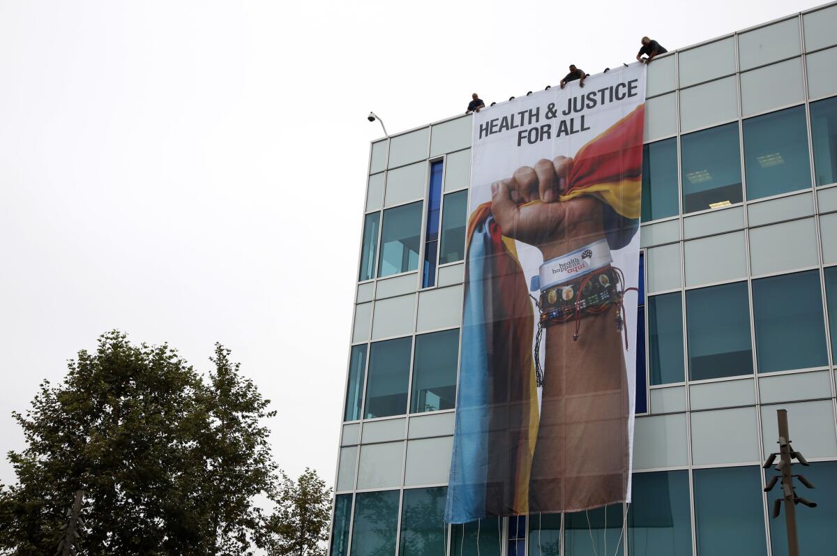 A 700-square-foot banner on the side of the California Endowment's building celebrates the budget signed by Gov. Jerry Brown, which includes healthcare for children in the country illegally.
