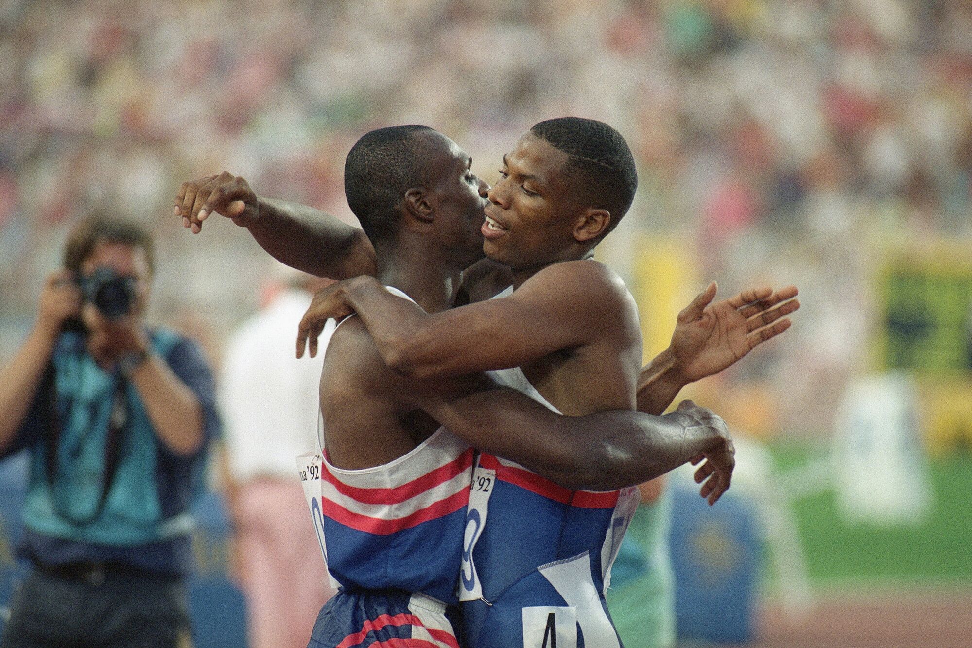 Americans Quincy Watts, right and Steve Lewis embrace after finishing first and second, respectively, in the 400 meters.
