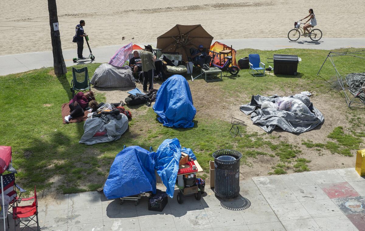 A homeless encampment on a boardwalk in Venice Beach.