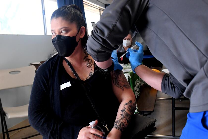 HAWAIIAN GARDENS, CALIFORNIA APRIL 2, 2021-Magdalena Vargas receives a Jonson and Jonson vaccine at a pop-up clinis in Hawaiian Gardens. (Wally Skalij/Los Angeles Times)