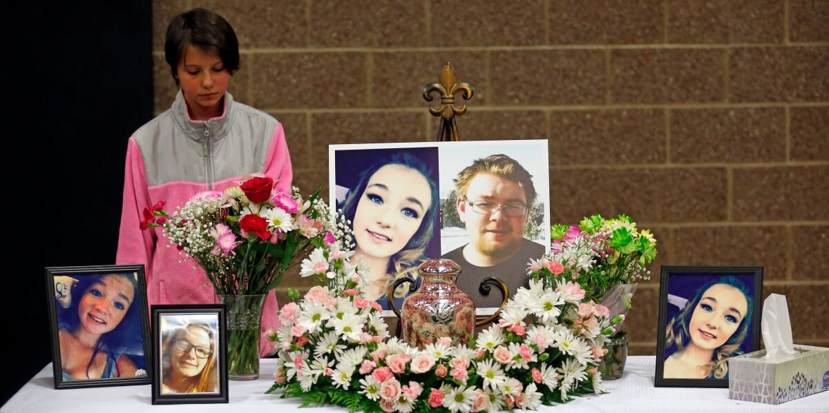 FILE - Ciara Coleman looks on during a funeral service on April 7, 2018, for Brelynne "Breezy" Otteson, 17, and boyfriend Riley Powell, 18, in Eureka, Utah. The case of a teenage couple killed and tossed down an abandoned mine shaft culminated in murder convictions Friday, April 15, 2022, for a Utah man who prosecutors said killed the pair because he found them hanging out with his girlfriend. Jarrod Baum, 45, faces up to life in prison after a jury found him guilty of two counts of aggravated murder, aggravated kidnapping and other counts in the 2017 slayings after a monthlong trial. (AP Photo/Rick Bowmer, File)
