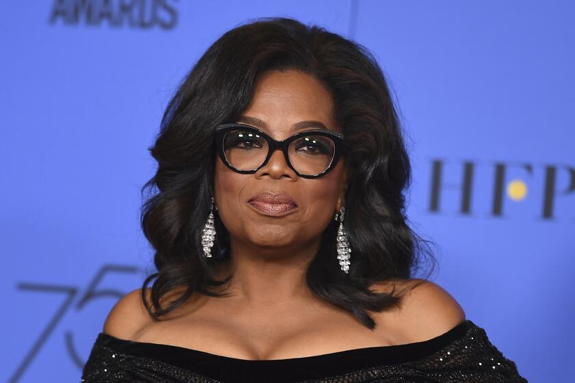 FILE - In this Jan. 7, 2018 file photo, Oprah Winfrey poses in the press room with the Cecil B. DeMille Award at the 75th annual Golden Globe Awards in Beverly Hills, Calif. Winfrey will interview two men who say Michael Jackson sexually abused them as boys immediately after a documentary on the men. HBO and the Oprah Winfrey Network announced Wednesday that ?After Neverland,? will air on both channels Monday at 10 p.m. Eastern and Pacific. (Photo by Jordan Strauss/Invision/AP, File)