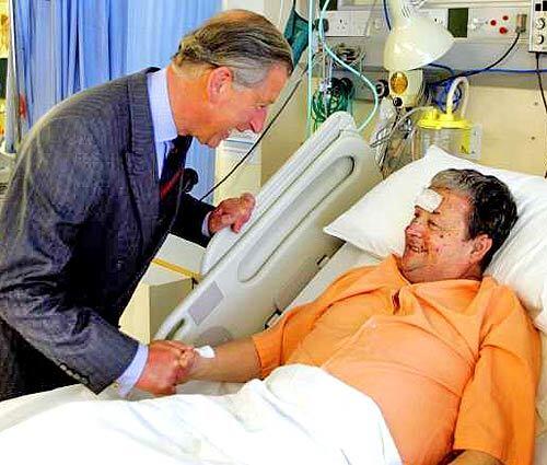 Prince Charles talks to John Tulloch, one of those wounded in a bomb blast,at St.Mary's Hospital, London.