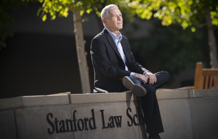  Joe Bankman sits outside at Stanford Law School 