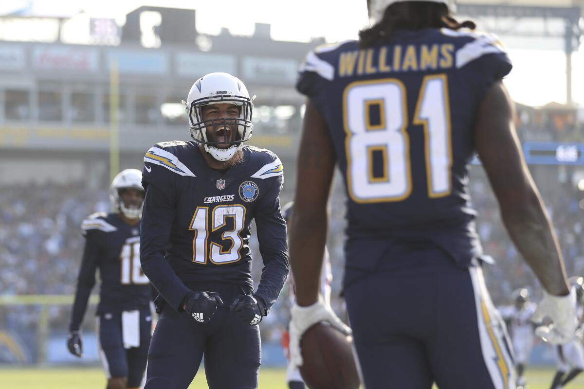 Chargers receiver Keenan Allen (13) celebrates a catch by teammate Mike Williams (81).