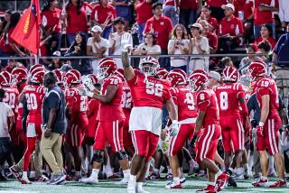 Mater Dei's Tomuhini Topui (52) starts celebration in win over Bishop Gorman.