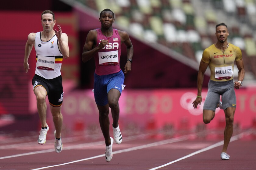 Erriyon Knighton, center, competes in a heat of the men's 200 meters at the Tokyo Summer Olympics on Aug. 3.