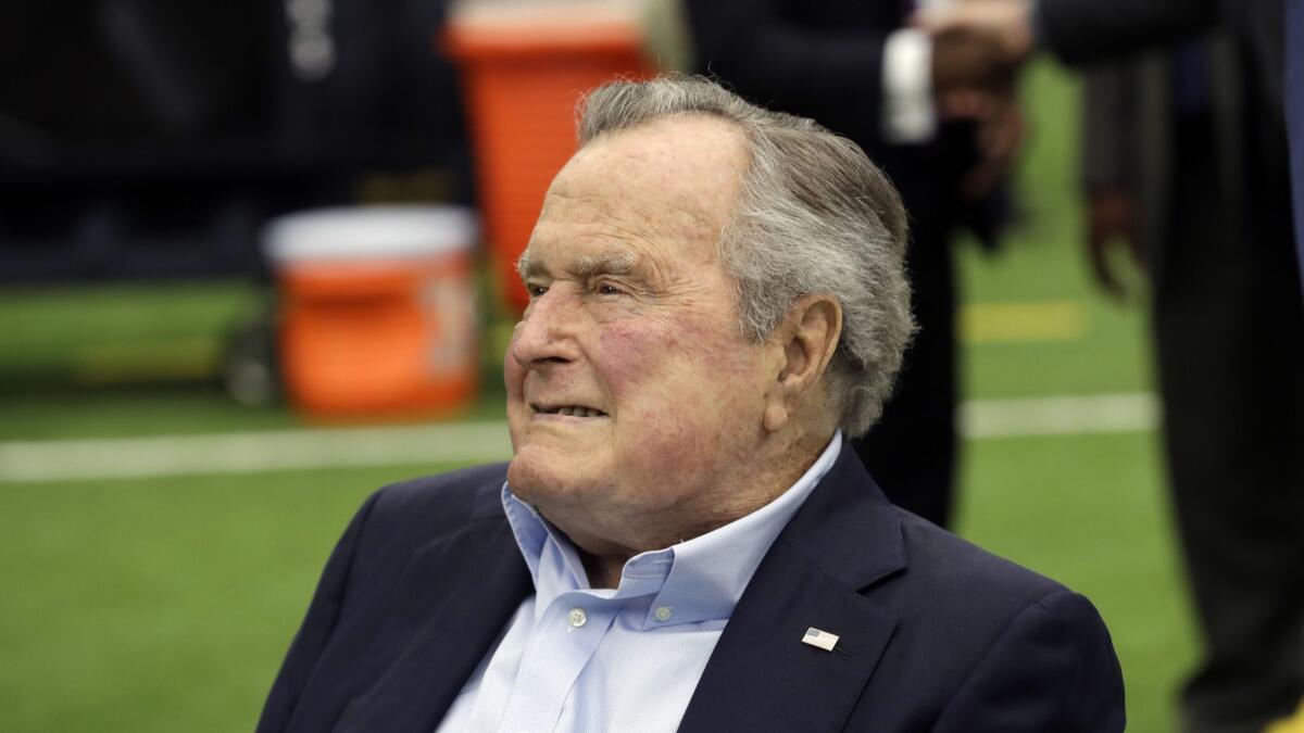 Former President George H.W. Bush arrives for an NFL football game between the Houston Texans and the Indianapolis Colts in Houston on Nov. 5, 2017.