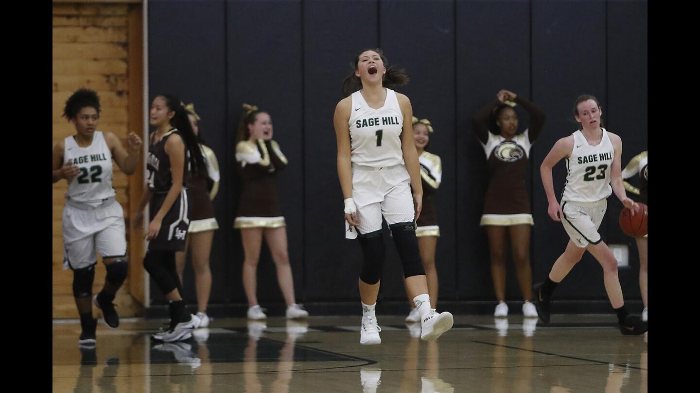 Sage Hill School's Emily Elliott (1) reacts after the Lightning defeat the Laguna Hills Hawks, 45-43, in the first round of the CIF Southern Section Division 4AA playoff game on Thursday in Newport Beach.