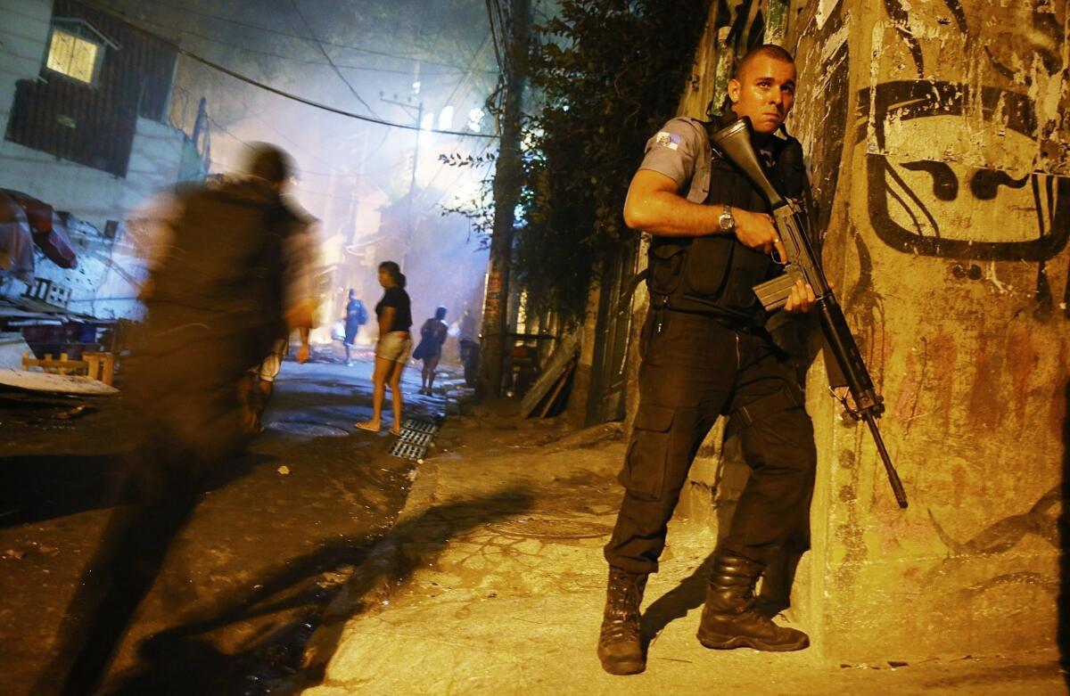 Brazilian police patrol Tuesday night after an operation in the Pavao-Pavaozinho favela, just blocks from Rio de Janeiro's Copacabana Beach, ended in the death of a TV dancer, sparking further street violence.