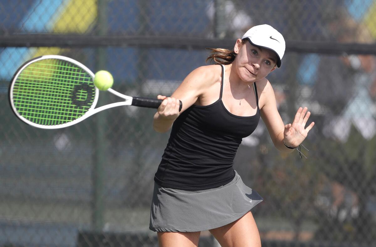 No. 1 seed Emily Deming hits a forehand against Laguna's Jessica MacCallum at the Tennis Club at Newport Beach on Monday.