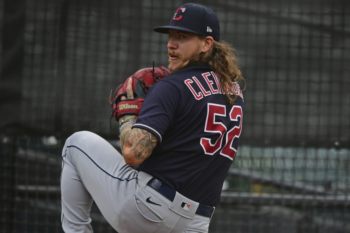 Cleveland Indians starting pitcher Mike Clevinger warms up in the bullpen 