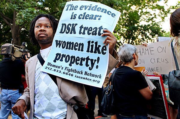 Imani Henry of New York protests before the expected arrival of Dominique Strauss-Kahn outside Manhattan Criminal Court in New York Tuesday.