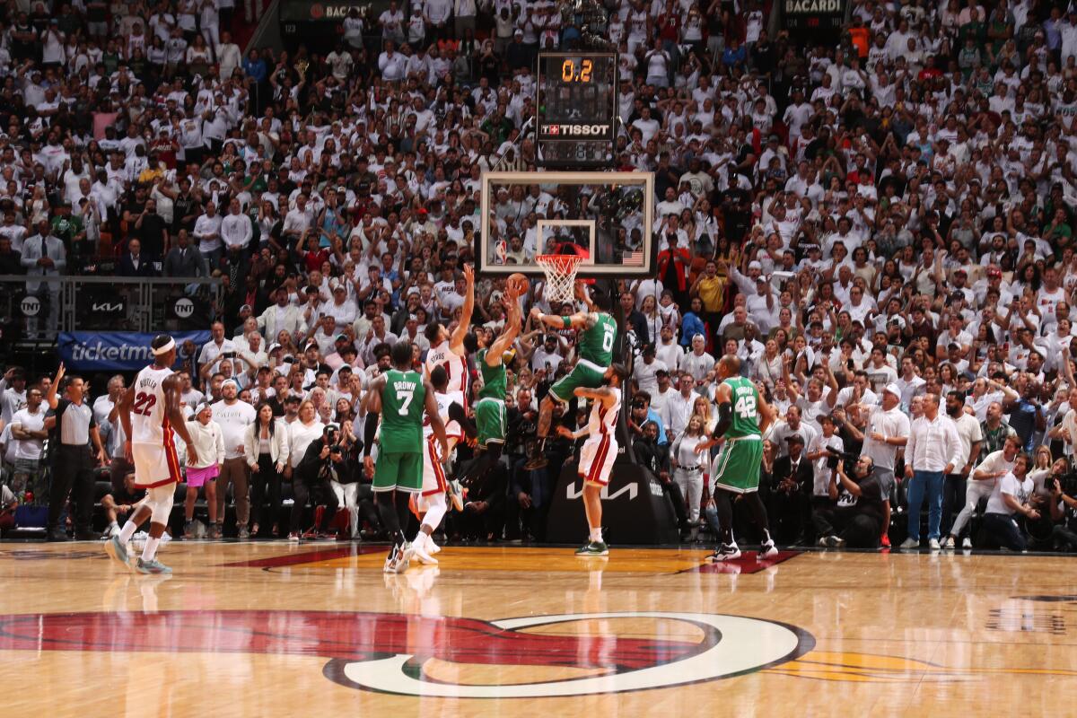 The Celtics' Derrick White scores on a putback with one-tenth of a second left against the Heat on May 27, 2023.