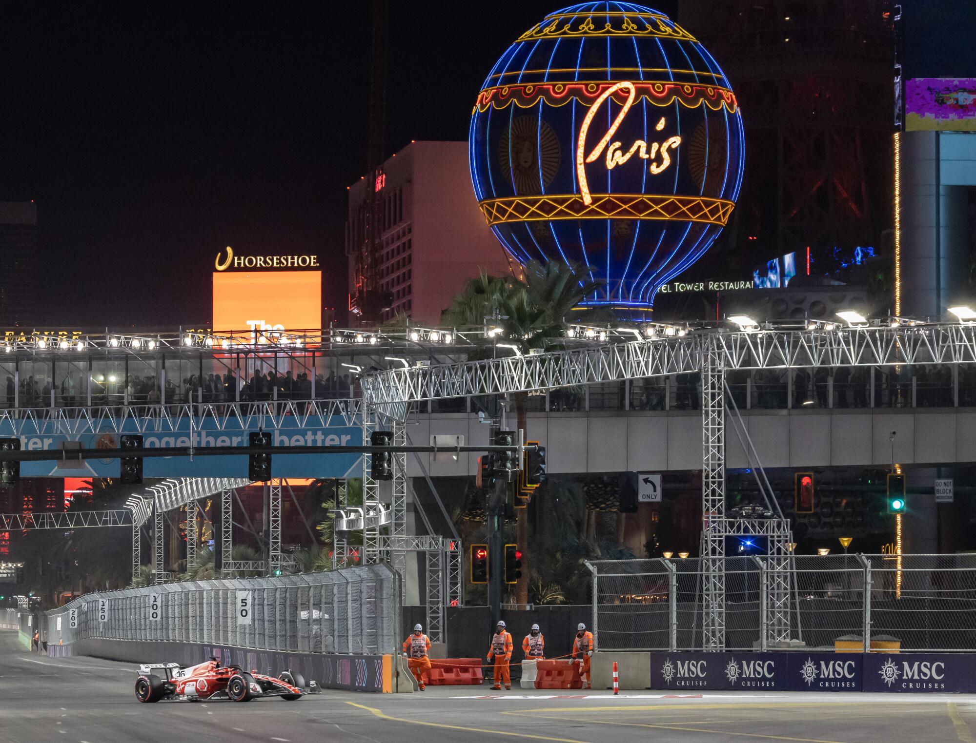 Ferrari's Charles Leclerc steers through Turn 14 coming off the Vegas Strip.