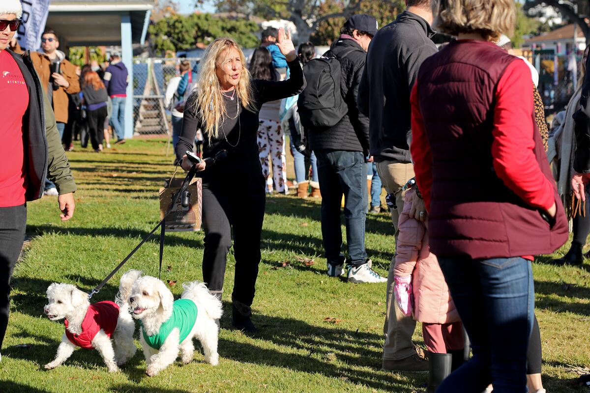 Valerie Torelli, founder of Torelli Realty, greets visitors as they line up for the annual Snow Land event.