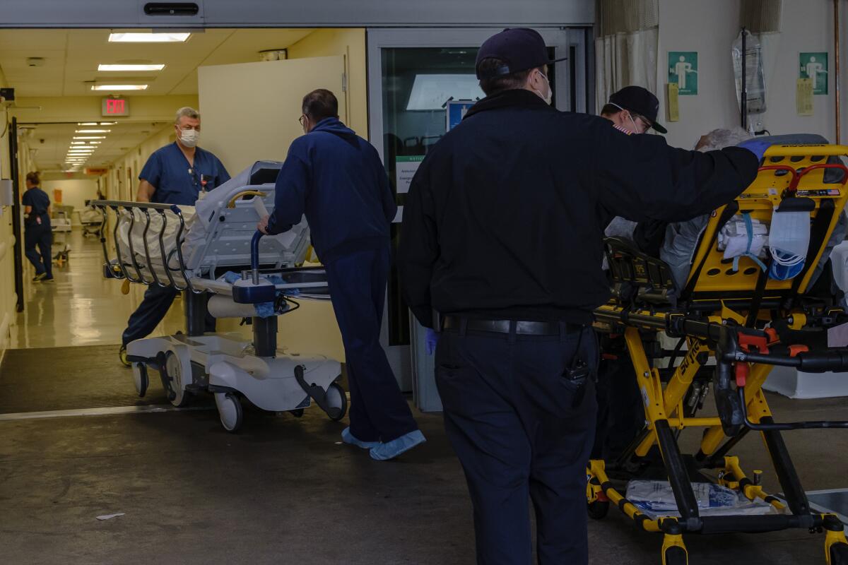 Patients arrive and are screened for COVID-19 symptoms at the medic staging area before entering the Sharp Memorial Hospital in San Diego in April.