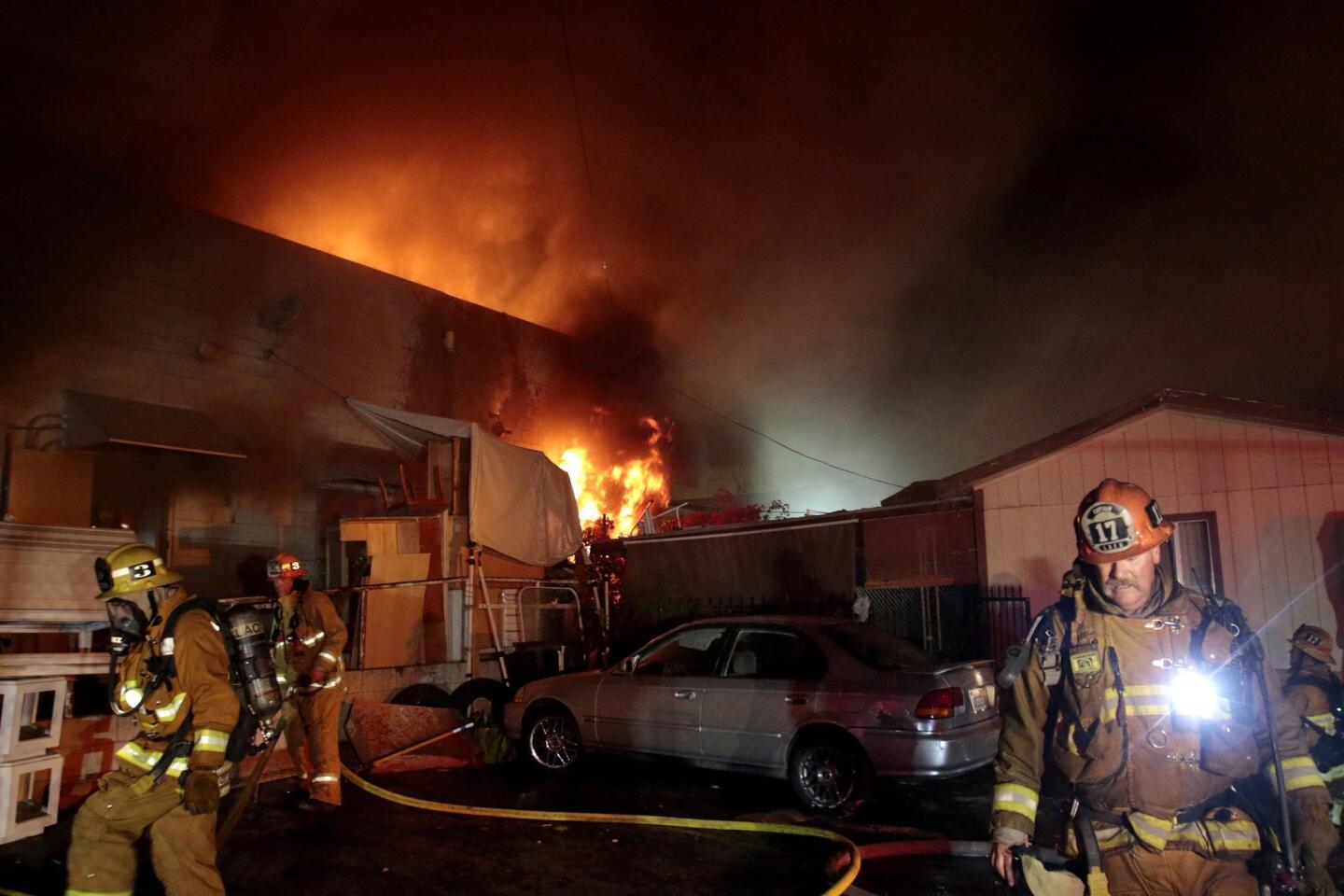 Firefighters battle a stubborn fire that raged in Boyle Heights early Thursday morning, causing extensive damage to a commercial building containing four businesses in the 3700 block of Whittier Boulevard.